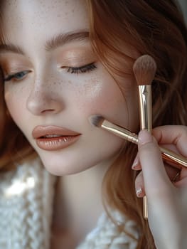 Fingers applying makeup with a brush, showcasing beauty routines and personal care.