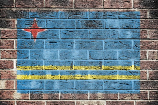 An Aruba flag on a brick wall background larkspur blue white stripes yellow four point star