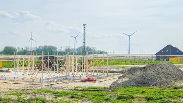 construction site of a new Dutch Suburban area with modern family houses, newly built modern family homes in the Netherlands preparing to building a new house