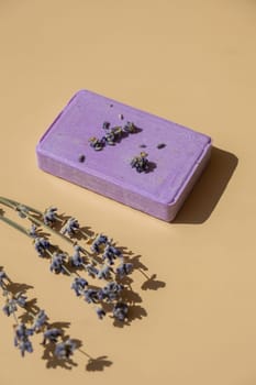 Handcrafted purple lavender soap with lavender flowers. Natural hydrating moisturiser softness cosmetic. Organic calming beauty skincare product. Herbal self care wellness alternative soap. Copy space