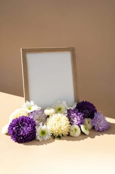 Holiday postcard greeting card photo frame empty paper note around mixed colorful flowers. Copy space mockup template. Minimalistic isometric style Advertisement sample