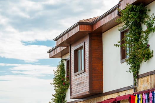 Restored houses with bay windows on the historical streets of Side Antalya