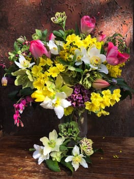 Romantic bouquet of the first garden flowers in a vase. The art of flower arranging