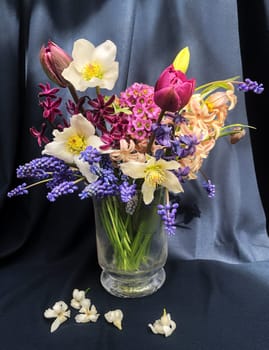 Romantic bouquet of the first garden flowers in a vase. The art of flower arranging