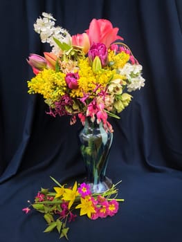 Romantic bouquet of the first garden flowers in a vase. The art of flower arranging