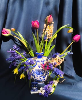 Romantic bouquet of the first garden flowers in a vase. The art of flower arranging