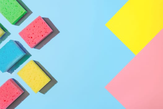 Bright and Colorful Cleaning Sponges: A Flat Lay for Cleaning Services or Housekeeping, copy space. Flat Lay of Cleaning Sponges: A Colorful, Bright and Eye-Catching Display for Cleaning Services.