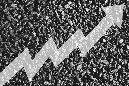 Arrow up on coal background. The concept of price growth, mining, import, export, production, sales or supply of coal.