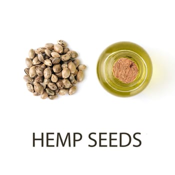 Hemp seeds and Hemp raw oil isolated on white background. Heap of hemp seeds and raw hemp oil in small glass bottle - creative layout. Isolated on white with clipping path, top view or flat lay. Macro