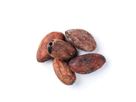 Raw cacao beans top view on white background. Close up view of raw cacao beans isolated on white with clipping path.