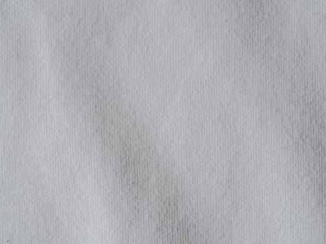 White cotton fabric texture. Clothes cotton jersey background with folds