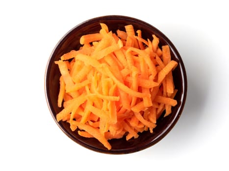 Fresh organic shredded carrots in small white bowl. Raw grated carrots isolated on white with clipping path. Top view or flat lay.