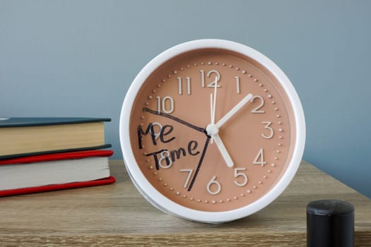 Clock on shelf with an inscription me time.