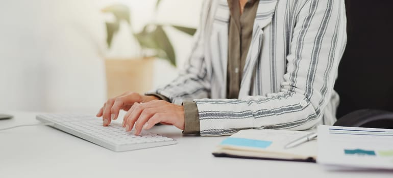 Computer, hands and business with woman, keyboard and typing for email and company website news. Person, consultant and agent with pc and notebook for planning and schedule with internet and tech.