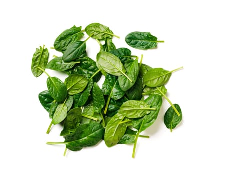Heap of baby spinach leaves. Fresh green baby spinach isolated on white with clipping path. Top view or flat lay