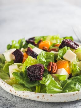 Beetroot, Feta Cheese and Orange Salad. Close up. Copy space for text. Gray concrete background
