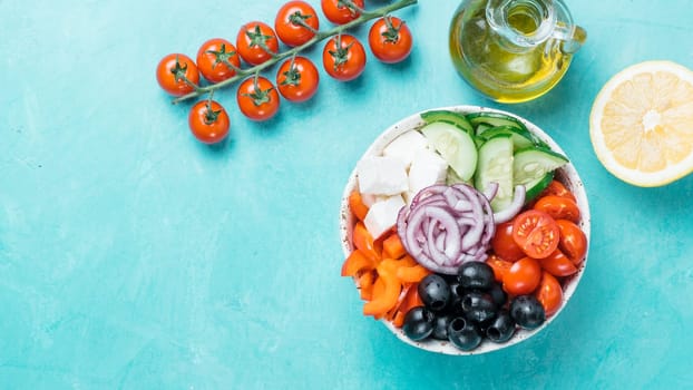 Greek Salad Bowl on blue background, copy space. Above view of Bowl Greek Salad. Trendy food. Idea, recept and concept of modern healthy food. Banner