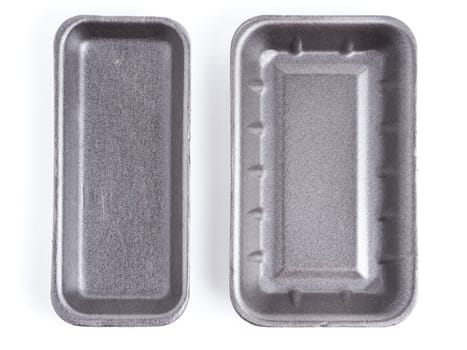 Set of two black empty food tray. Black disposable styrofoam isolated on white background