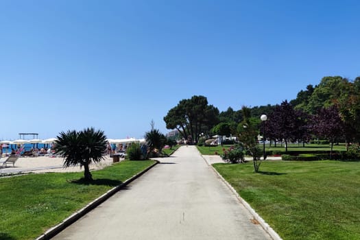 Varna, Bulgaria - June 24, 2023: sunny promenade at the Black Sea resort of Golden Sands