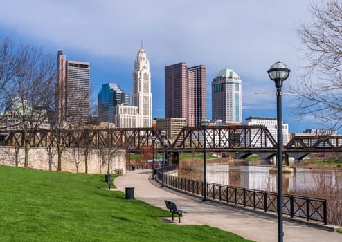 Columbus Ohio waterfront view of the downtown financial district from the River Scioto through a railroad truss bridge