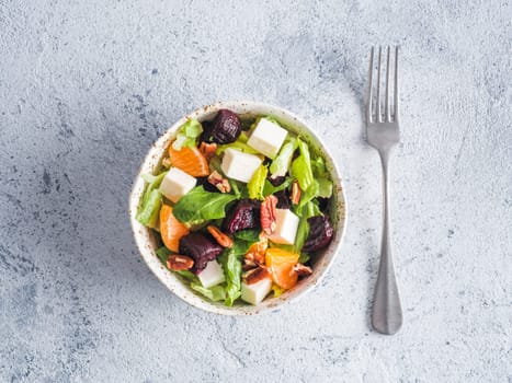 Beetroot, Feta Cheese and Orange Salad. Close up. Top view or flat-lay. Copy space for text. Gray concrete background