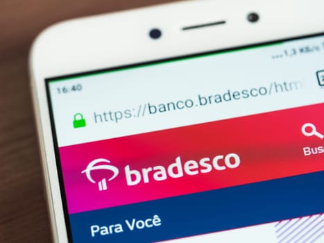 Moscow, Russia - June 03, 2019: Bradesco logo on smartphone screen. Logo of Bradesco company on main page of site. Selective focus.