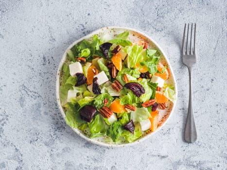 Beetroot, Feta Cheese and Orange Salad. Close up. Top view or flat-lay. Copy space for text. Gray concrete background