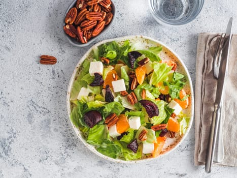 Beetroot, Feta Cheese and Orange Salad. Close up. Top view or flat-lay. Copy space for text. Gray concrete background