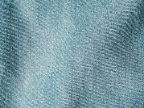 Modern soft jeans blouse texture close up. Lyocell or tencel pattern - modern natural cellulose fabric blue denim color. Can use for design or text. Copy space