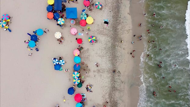 Beautiful aerial view with drone to one of the beaches south of Lima in Peru where you can see umbrellas and people enjoying the summer. 2.7k resolution