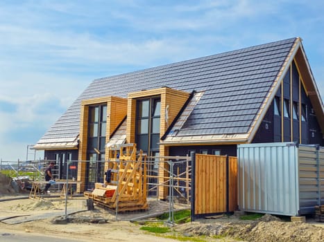 construction site of a new Dutch Suburban area with modern family houses, newly built modern family homes in the Netherlands