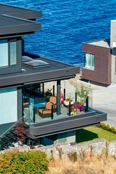 A perfect neighborhood. Patio of luxury residential house on Pacific ocean shore.