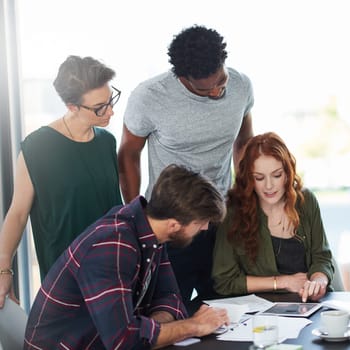 Tablet, teamwork or people in startup for news, conversation or group discussion in office together. Paperwork, meeting or colleagues planning strategy, feedback data or info online in collaboration.