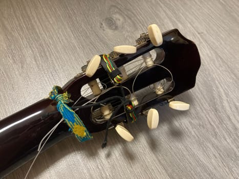 Acoustic guitar and its elements for the playing
