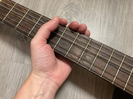 Acoustic guitar and its elements for the playing
