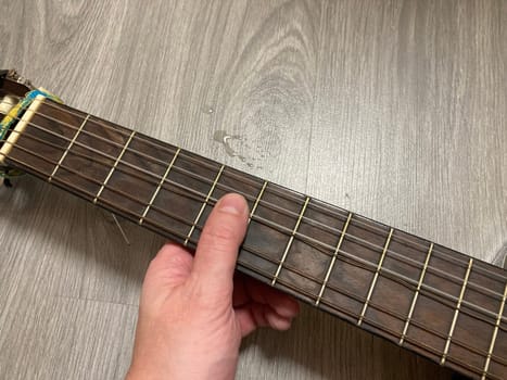 Acoustic guitar and its elements for the playing