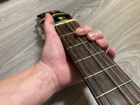 Acoustic guitar and its elements for the playing
