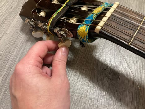 Acoustic guitar and its elements for the playing