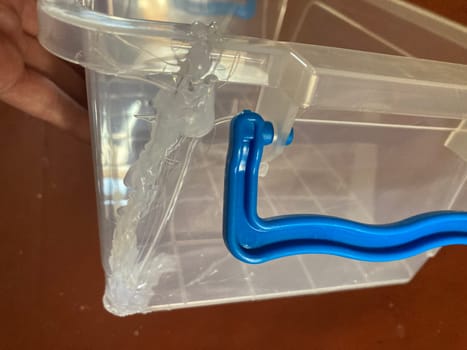 Gluing plastic containers using a the gun