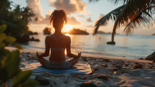 One girl practicing yoga at sunset performs Padmasana exercises, lotus poses.