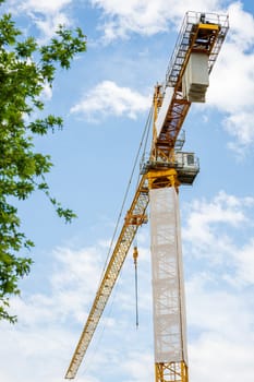 Construction crane working on large construction site