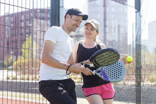 Padel lesson with a coach, personalized instruction in a supportive environment. High quality photo