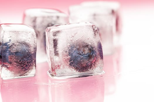 Ice cubes with berry for summer cocktails