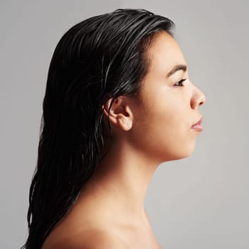 Woman, profile and beauty with haircare, cosmetics or skincare salon on a gray studio background. Young female person or model with wet hair or shower for spa, hygiene or keratin treatment on mockup.