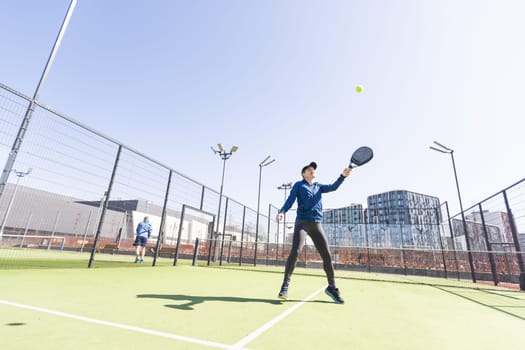 One women playing Paddle tennis. High quality photo