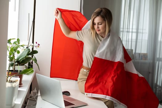 woman hands and flag of Canada on computer, laptop keyboard . High quality photo