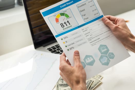 Fair credit score report with pen and calculator; document and the report are mocked-up. High quality photo