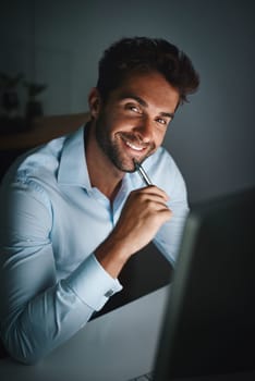 Smile, portrait and businessman with pen by computer for email, internet and working late in office for corporate career. Happiness, desk and lawyer with technology for communication in workspace.