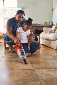 Parent, child and cleaning by vacuum floor of living room of house as teamwork to learning responsibility at home. Family, chores and care by helping, bonding and cooperation for natural growth.