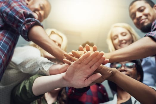 People, group and hands stack as teamwork or community trust, collaboration or diversity. Friends, pile and students or project planning together for global equality or allyship, partnership or union.